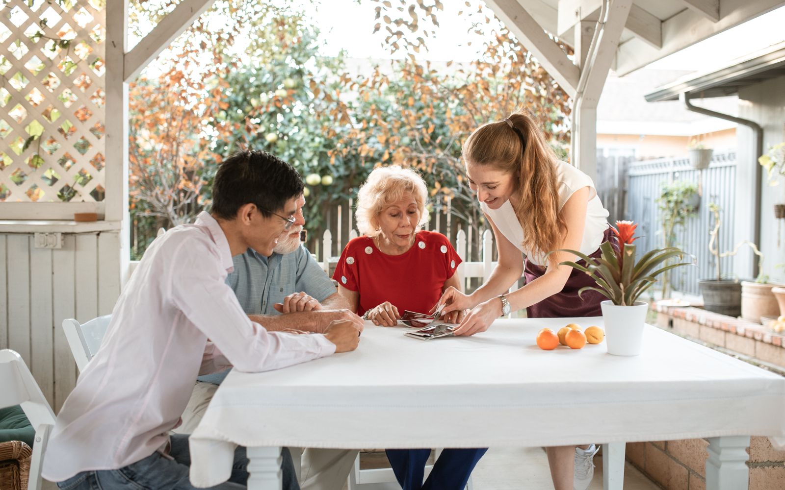 A person reviewing their phone contacts while planning at a table